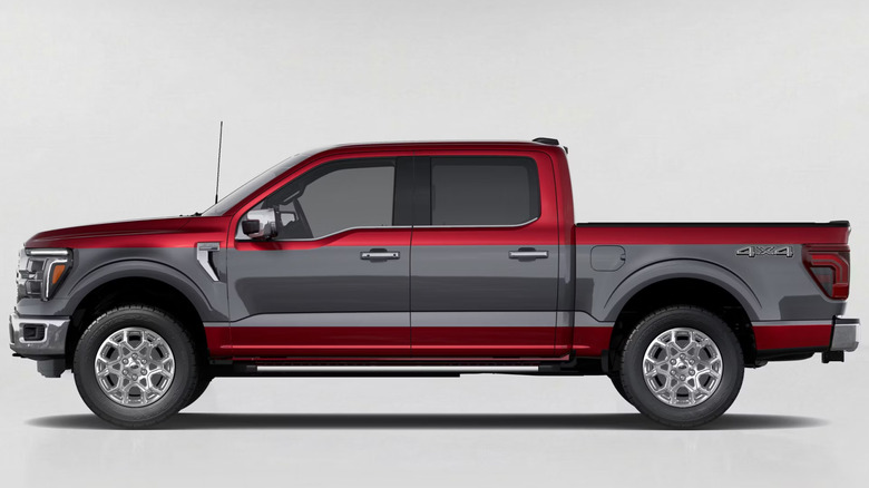 A side view of a red 2027 F-150 with a carbonized gray stripe down the side in front of a flat gray background