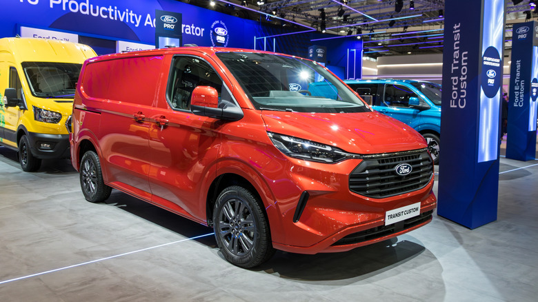 Red Ford Transit van at an auto show