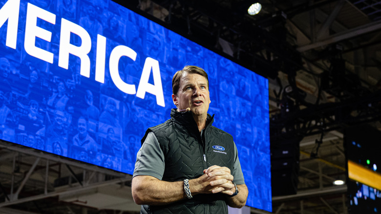 Ford CEO Jim Farley is seen giving a speech at a car factory