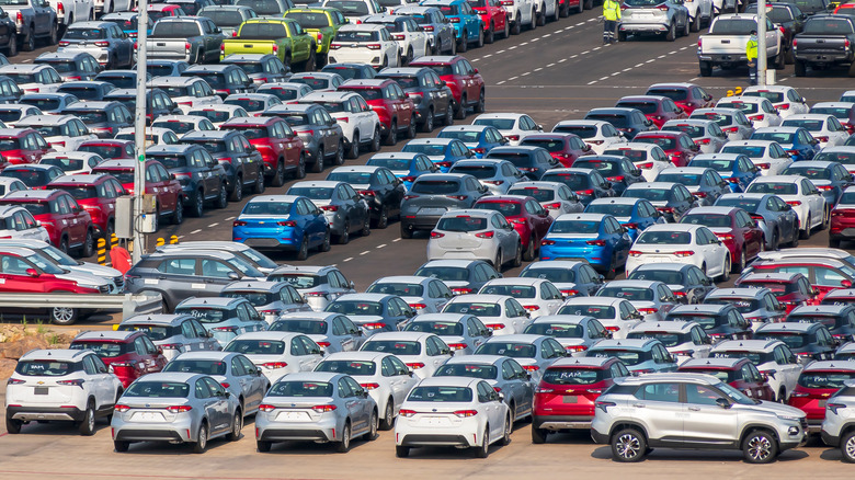 Lazaro Cardenas, Mexico - 09.30.2023: New cars are waiting to be loaded on a ship in the port of Lazaro Cardenas, Mexico.  by: ambient_pix