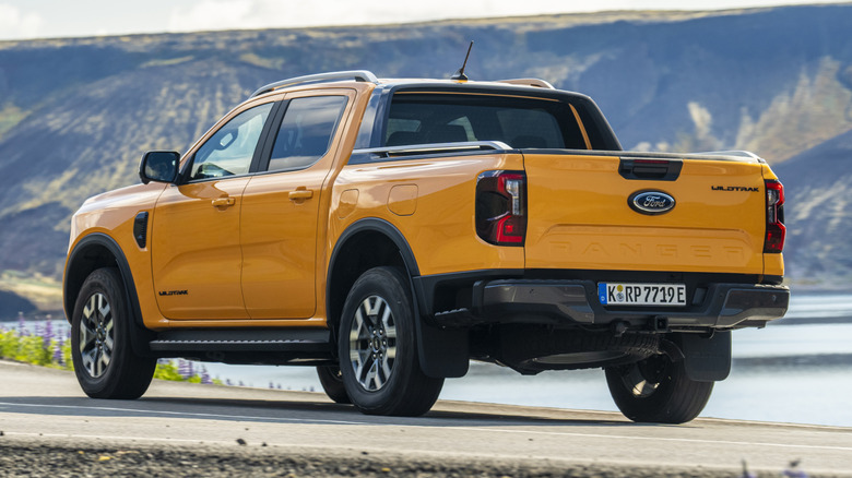 Rear 3/4 view of a yellow Ford Ranger PHEV