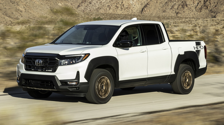 Front 3/4 view of a Honda Ridgeline Sport driving at speed