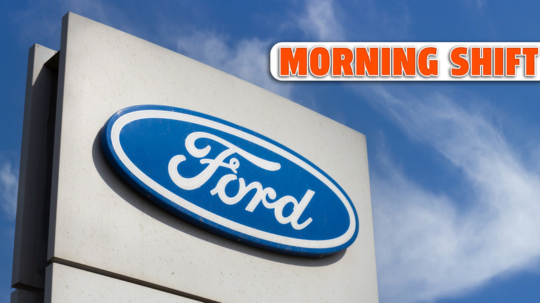 Krasnoyarsk, Russia - May 19, 2022: Close-up Ford brand logo on against blue sky background. Dealership centre of car shop