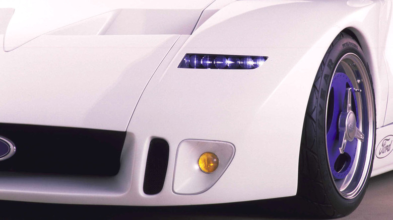 The front left side of a pale pink Ford GT90