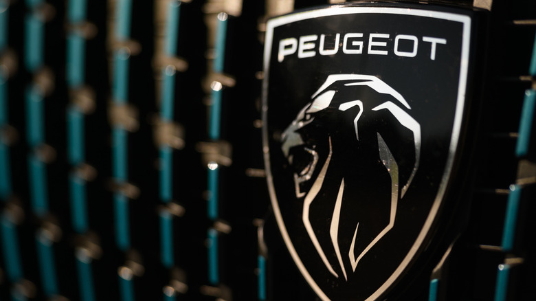 Izmir, Turkey - May 14 2025: Close up photo of the Peugeot logo on the front grille of a 2024 Peugeot 2008 GT