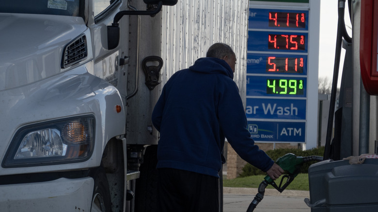 A driver buys diesel fuel for his truck at a tollway oasis on April 06, 2026 in Belvidere, Illinois.