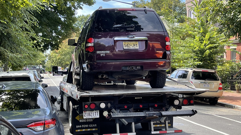 Andy Kalmowitz's Ford Explorer being towed away after the power steering pump gave out.