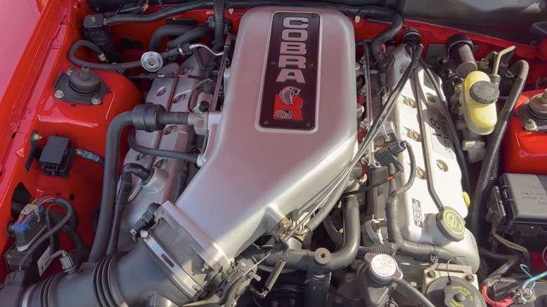 The 5.4-liter Cobra R V8 under the hood of a red 2000 Ford SVT Mustang Cobra R.