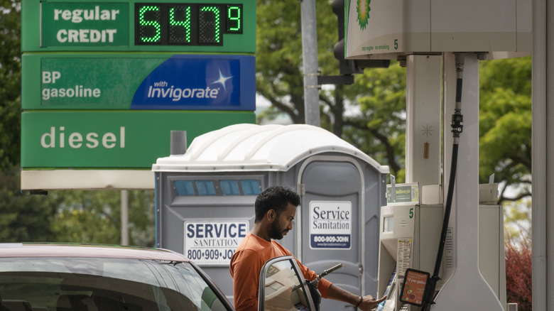 People fill up their cars at a BP gas station on May 21, 2026 in Skokie, Illinois.