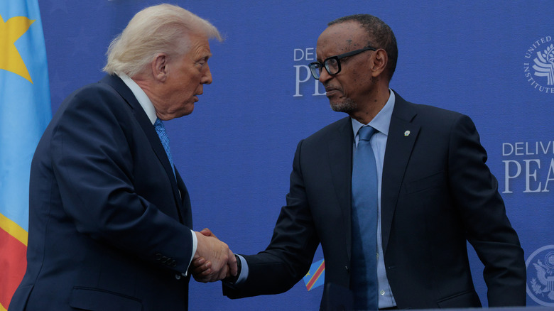 U.S. President Donald Trump shakes hands with Rwandan President Paul Kagame during a peace agreement signing ceremony between the Democratic Republic of Congo and Rwanda at the Donald J. Trump Institute of Peace on December 04, 2025 in Washington, DC.