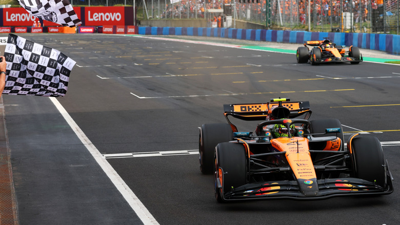A McLaren Formula 1 car wining a Grand Prix.