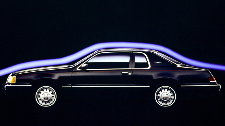 Side profile of a 1986 Ford Thunderbird in a wind tunnel.