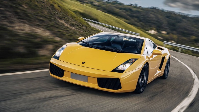 A Lamborghini Gallardo driving on a winding road