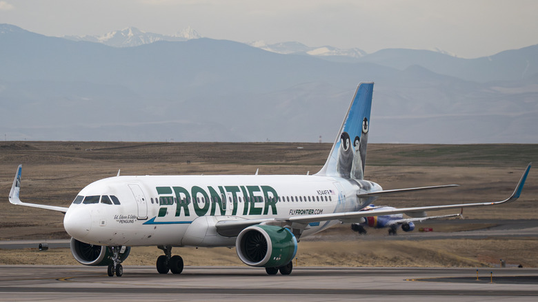A Frontier Airlines Airbus A320neo plane, owned by the Bank of Utah Trustee, taxis to a gate at Denver International Airport (DEN) on March 23, 2026 in Denver, Colorado.