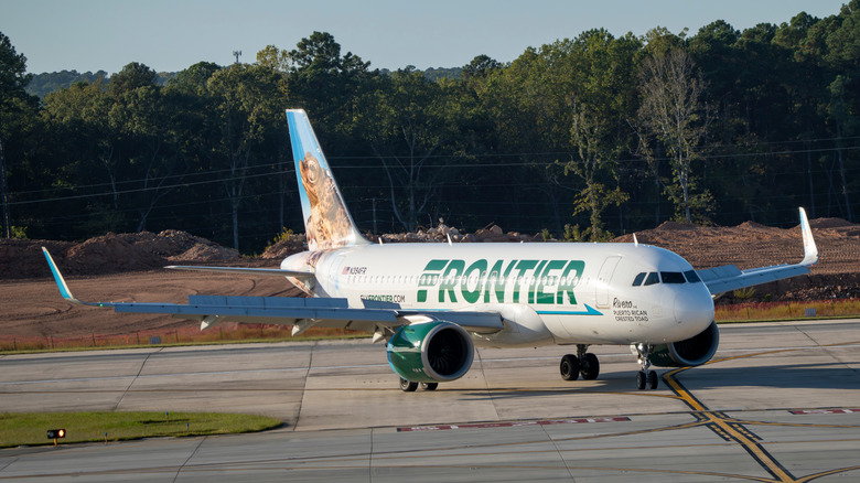 Frontier Airliner taxiing in the afternoon