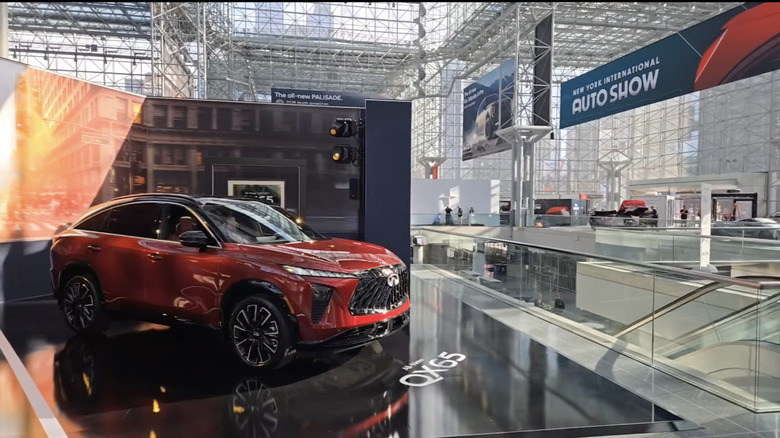 A red Infiniti QX65 sits on display in the Javitz center at the 2026 New York International Auto Show