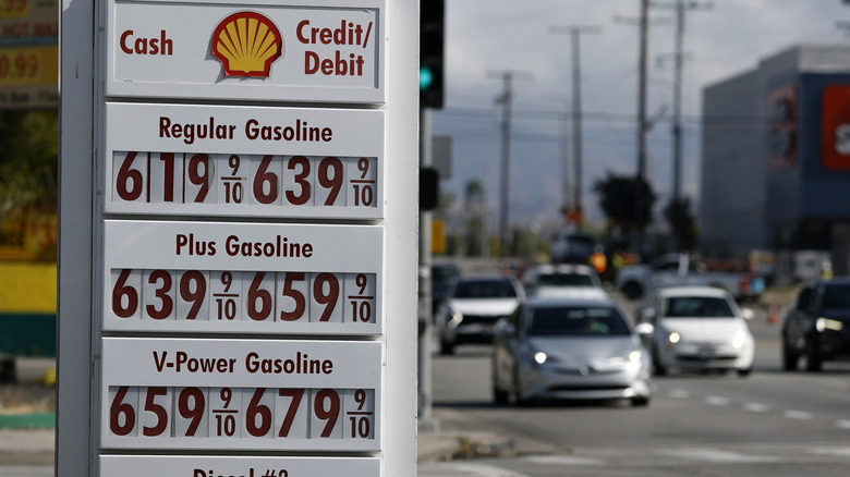 Shell gas sign shows regular gas pricing for $6.19 per gallon.