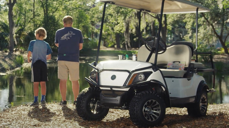 Yamaha Golf Car on leafy, muddy terrain