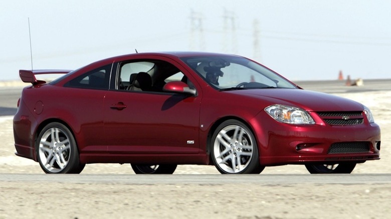 Front 3/4 of a dark red Chevrolet Cobalt SS on a racetrack.