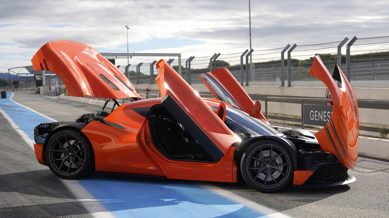 Side view of the orange Genesis Magma GT concept with the doors open