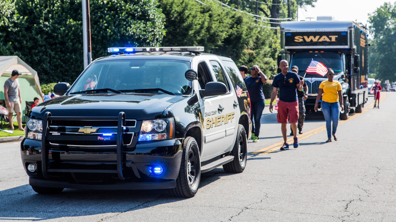 Participants and spectators in the annual Dunwoody, Georgia 4th of July parade which attracts over 2,500 participants and 32,000 spectators