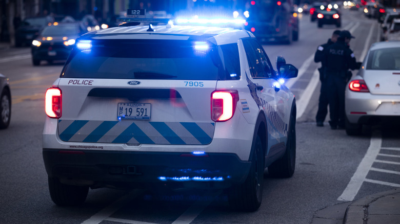 Rear view of a Chicago police car performing a routine traffic stop