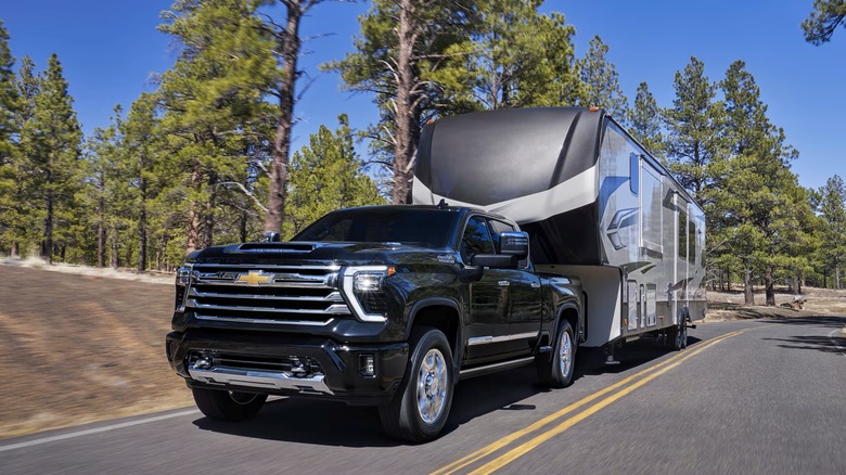 The Chevrolet HD 3500 towing a large 5th wheel camper.