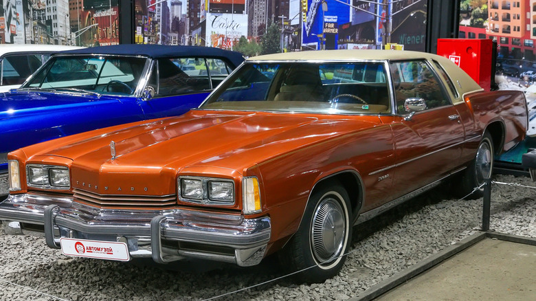 A brightly-colored Oldsmobile Toronado at a museum