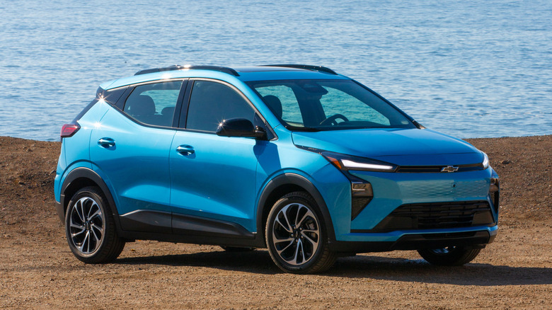 Front 3/4 view of a blue 2027 Chevrolet Bolt.