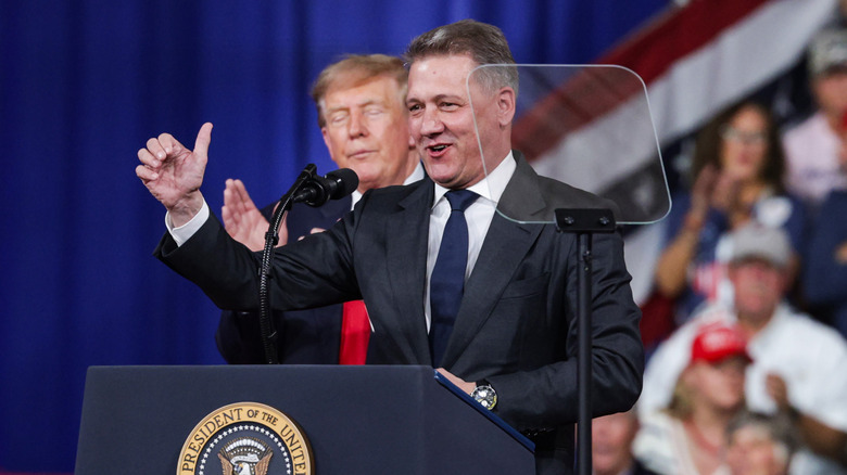 Audi AG CEO Gernot Dollner speaks alongside U.S. President Donald Trump during a midterm campaign rally at the Guardian Centers on October 24, 2026 in Perry, Georgia.