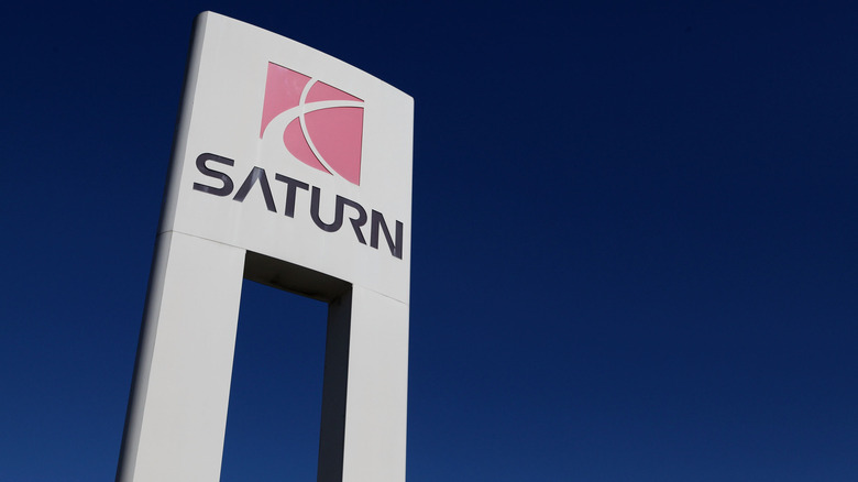 Saturn logo in front of a dealership in California