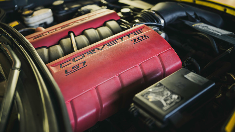 A close-up of a red-topped Corvete 7-liter LS7 engine.