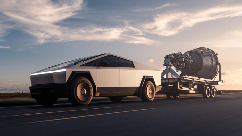 Tesla Cybertruck towing heavy machinery