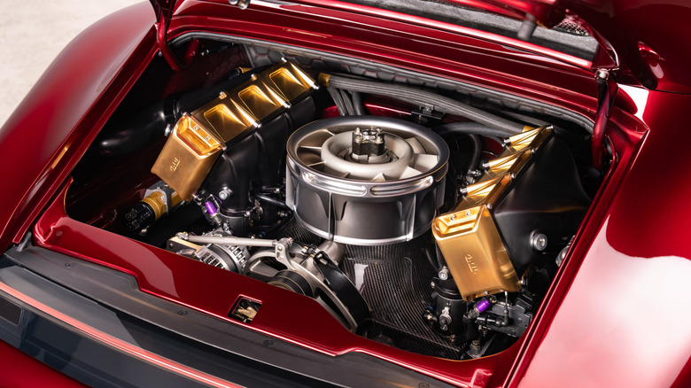 A close-up of Project Endgame's rear-mounted engine with gold details