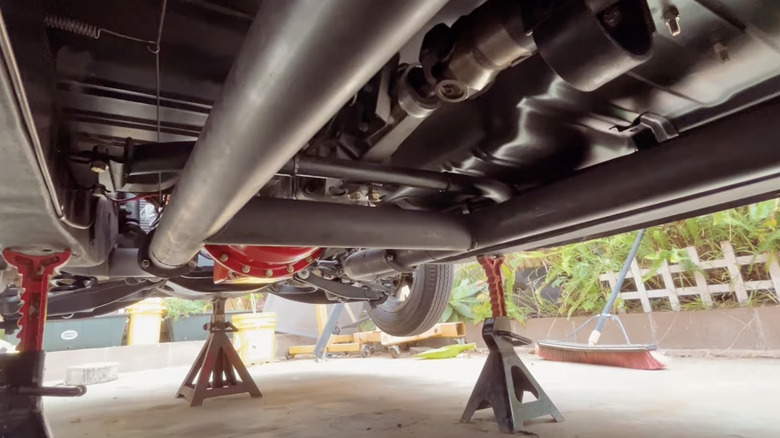 Underside of a classic car showing h-pipe exhaust system