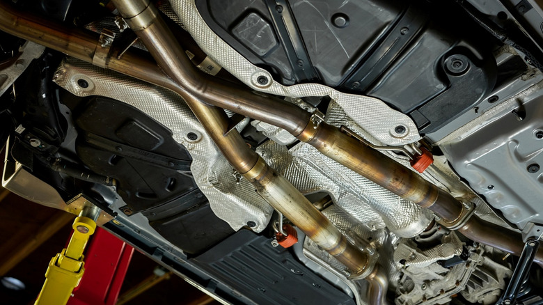 Underside of a car showing x-pipe dual exhaust system