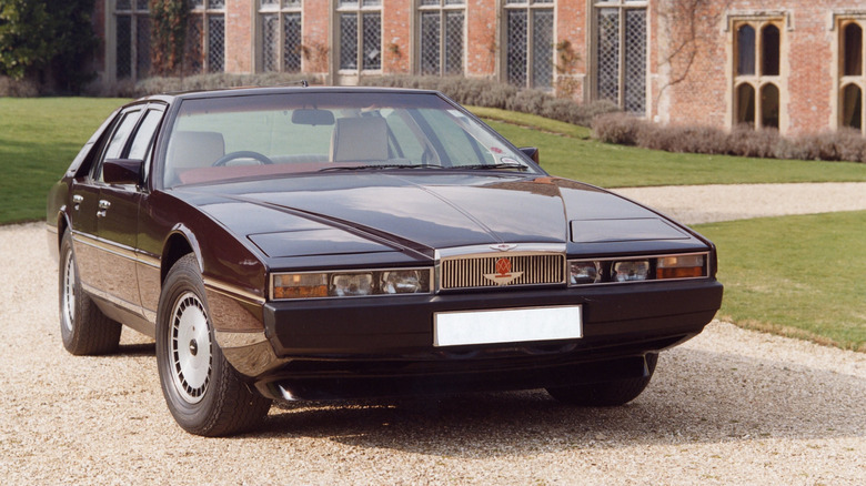 Aston Martin Lagonda Series 2 parked in a gravel driveway