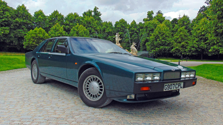 Aston Martin Lagonda in green on a stone drive