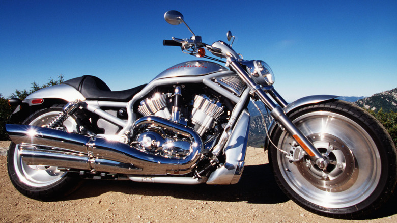 The Harley-Davidson V-Rod, with a Porsche-developed engine, in front of mountains and a blue sky