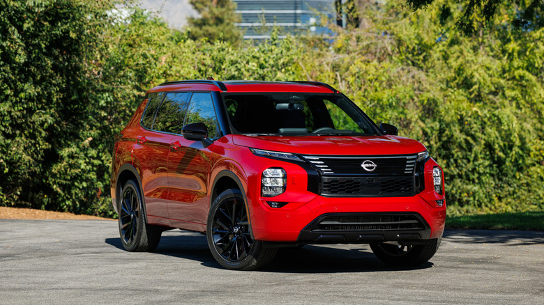 A red Nissan Rogue Plug-in Hybrid