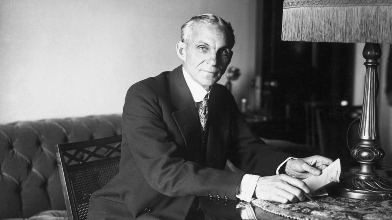 A vintage photo of Henry Ford at a desk