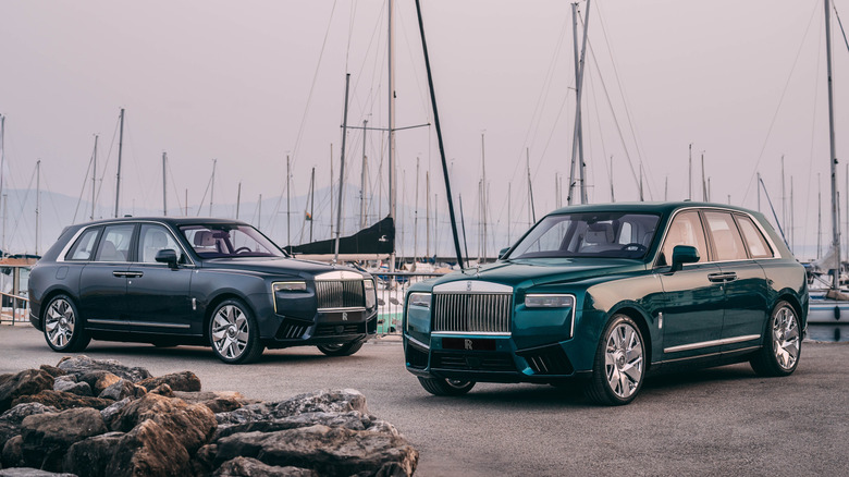 Two Rolls-Royce Cullinan Yachting SUVs with sailboats in the background