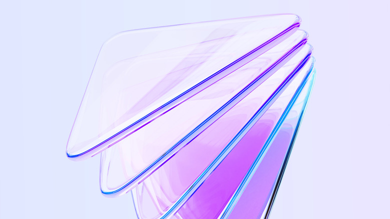 A 3D illustration of iridescent acrylic or glass triangular-shaped layers, with a rainbow light gradient on a blue background.