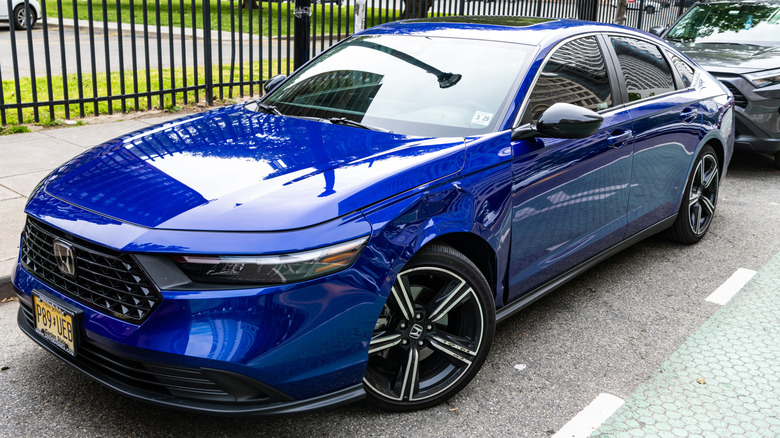 A blue Honda Accord Hybrid Sport parked on the road