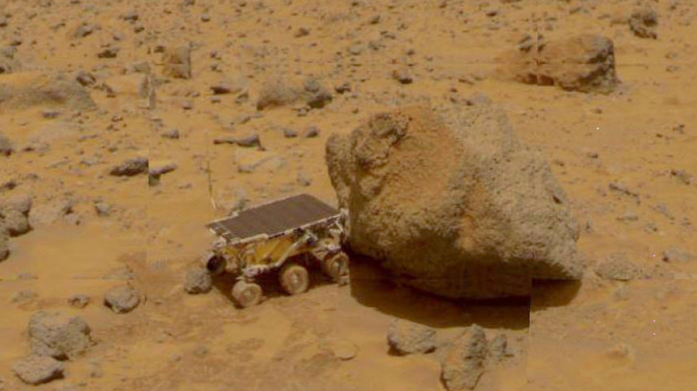The Sojourner rover examining Mars rock
