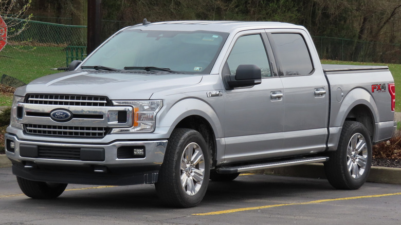 A silver 2020 Ford F-150 XLT SuperCrew 4x4 in a parking lot.