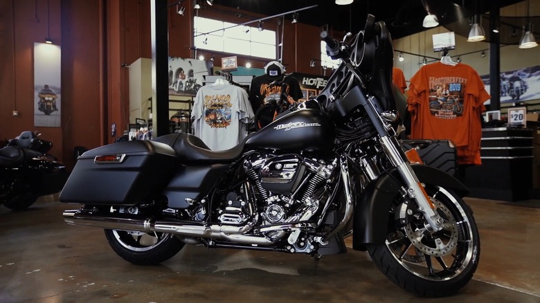A black 2020 Harley-Davidson Street Glide parked in a HD dealership showroom