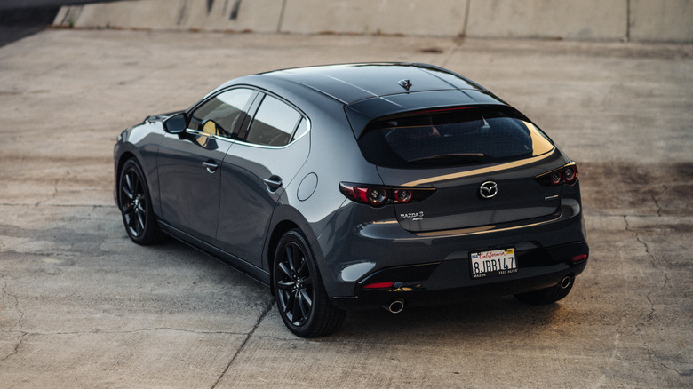 2020 Mazda3 Hatchback parked on a paved surface in front of a building