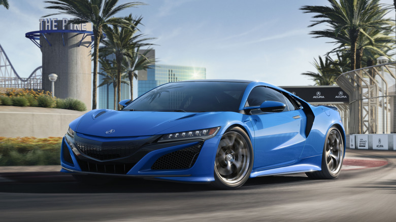 A blue 2021 Acura NSX being driven on the track.