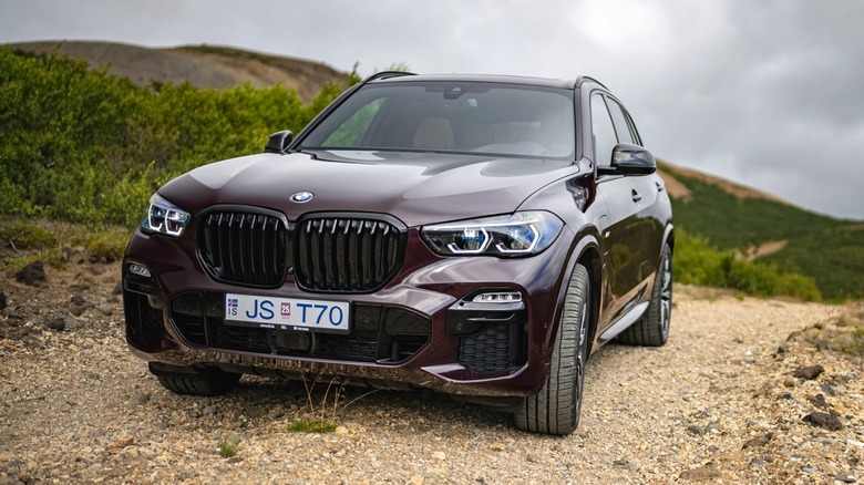 Press photo of a 2021 BMW X5 M Competition against an illuminated dark backdrop